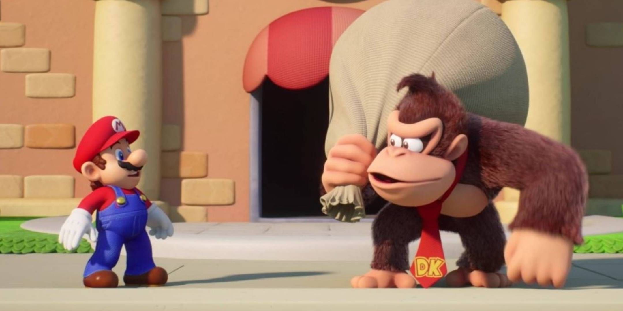 Mario confronting Donkey Kong who is holding a bag over his shoulder in Mario Vs. Donkey Kong.