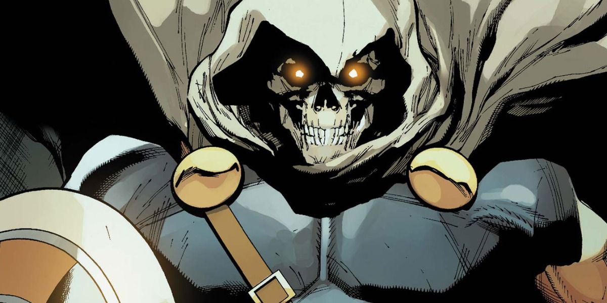 Taskmaster in costume, sporting a white cape and cowl over a skull mask.