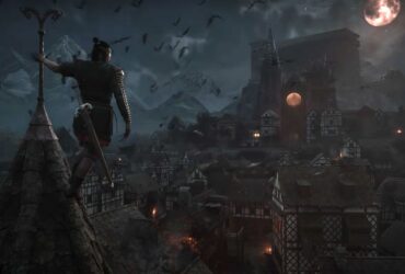 Coen looking over the village at night during the trailer for The Blood of Dawnwalker.