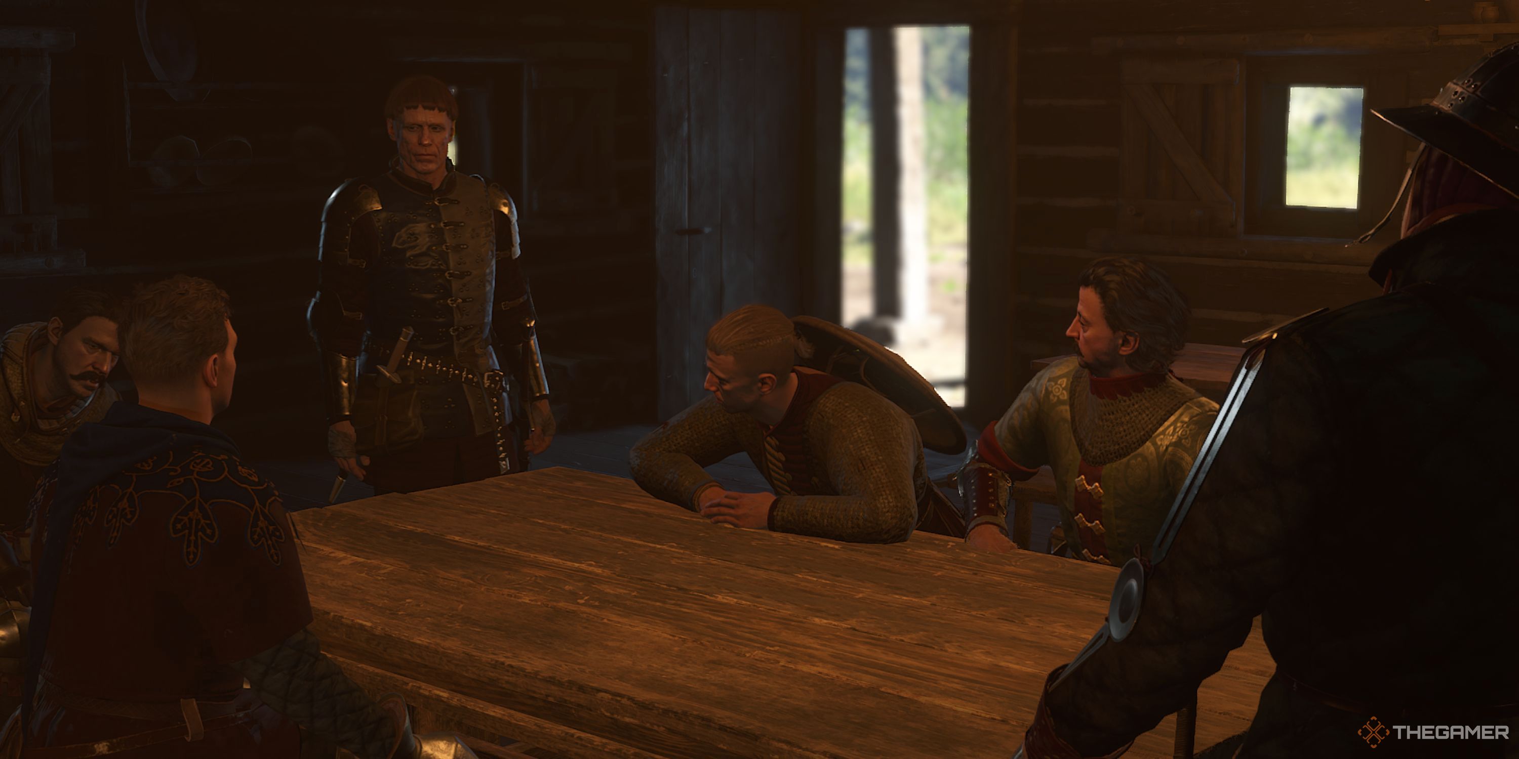 Dry Devil, his men, Zizka, and Henry talking in a Tavern.