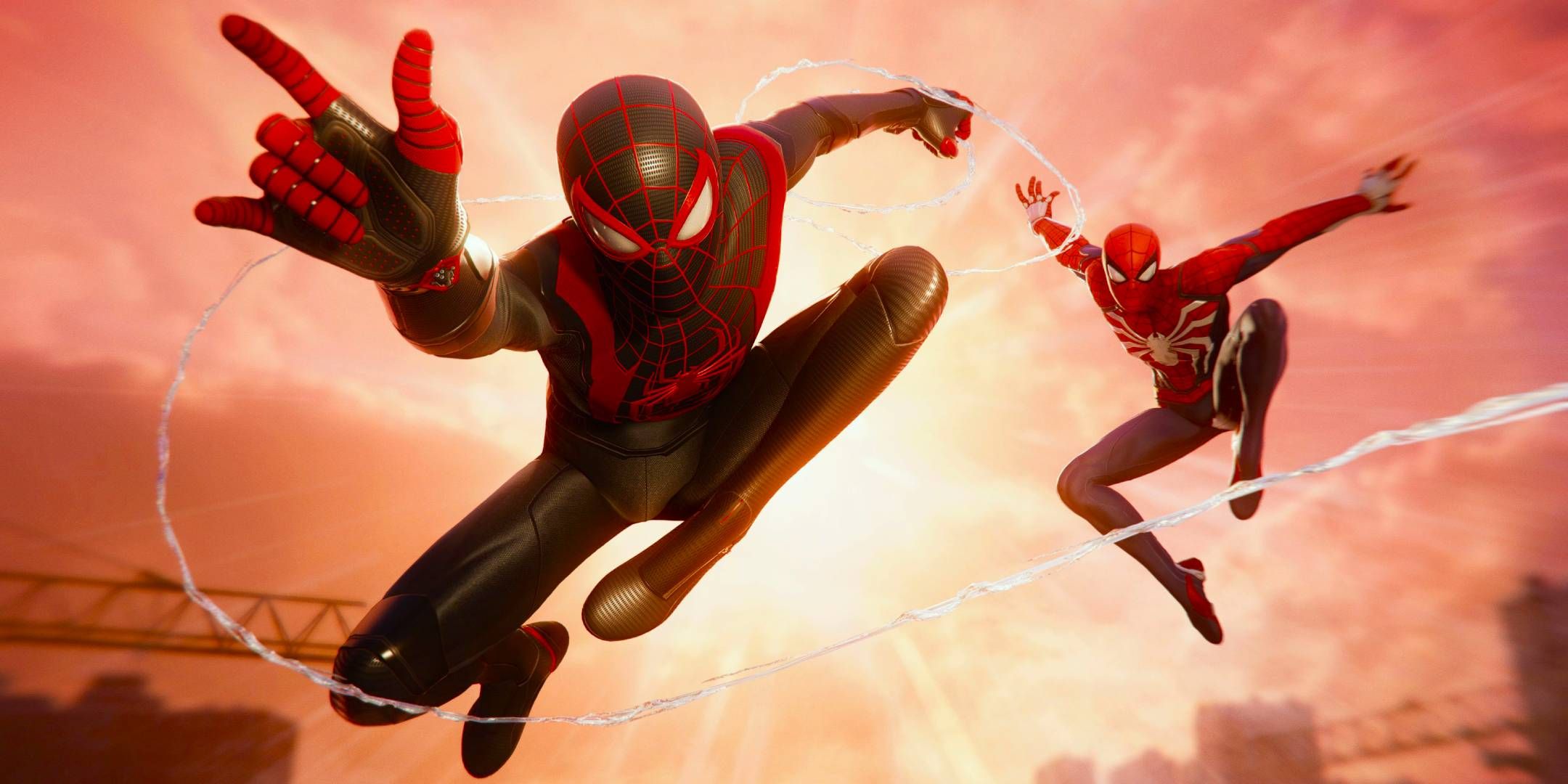 Marvels Spider-Man 2 screenshot of Peter Parker and Miles Morales both as Spider-Man swinging toward the camera.