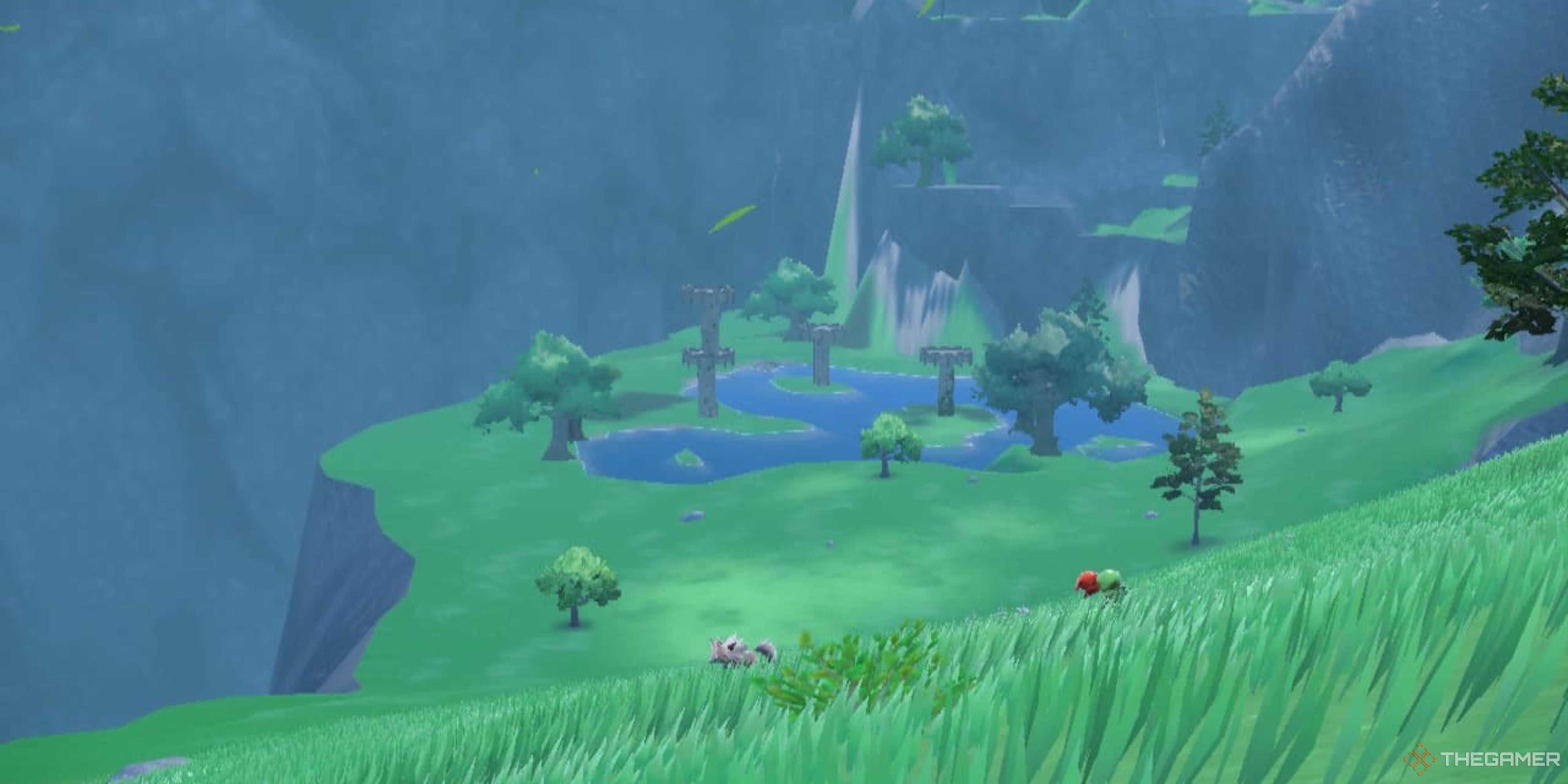 A landscape view shows a lake and three watchtowers in Pokemon Scarlet and Violet.