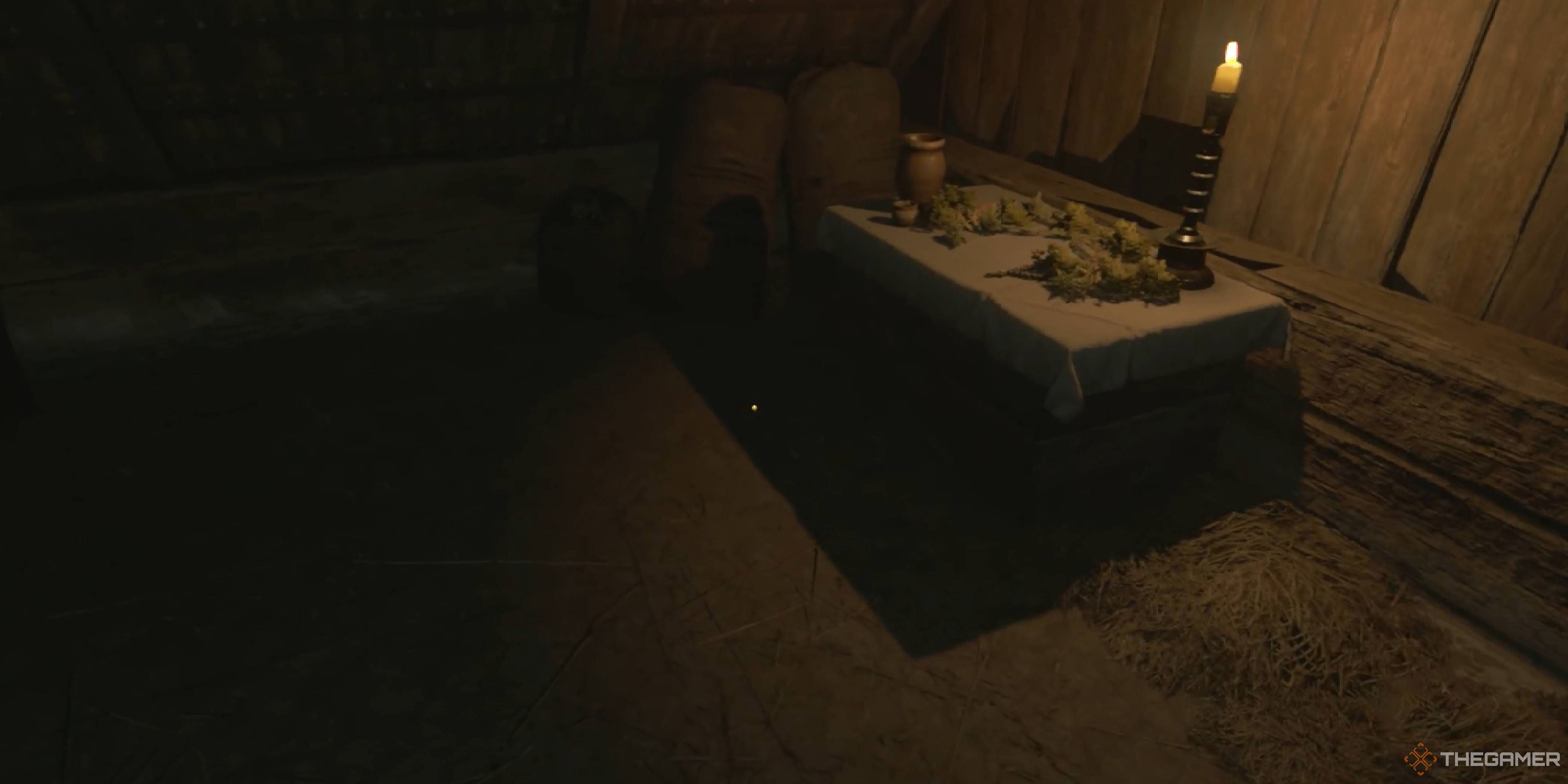 A gameplay screenshot showing a white table  in kingdom Come: Deliverance 2.