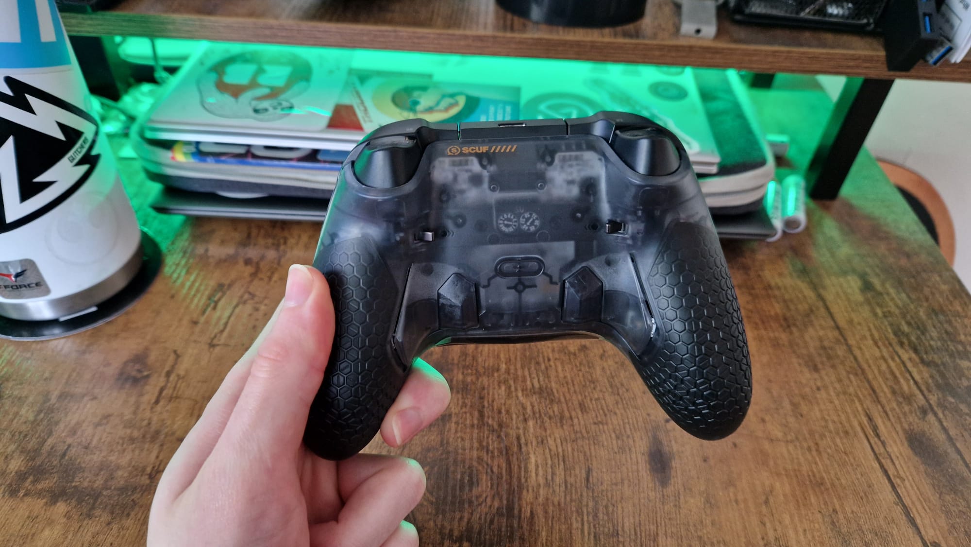 The back of the Scuf Valor Pro being held in front of the camera by a reviewer