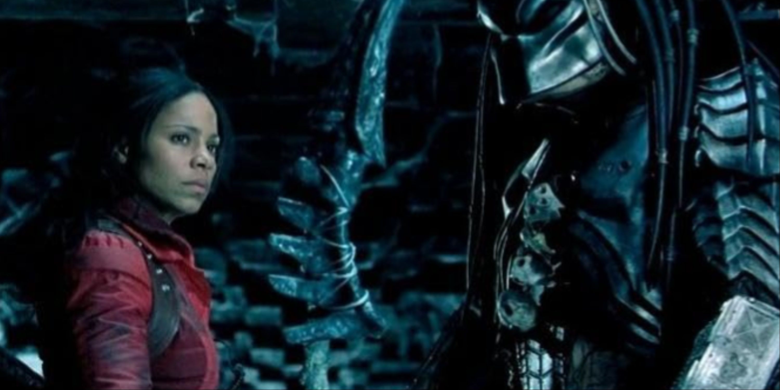 Sanaa Lathan's character Lex Woods in a red parka teaming up with a Predator.