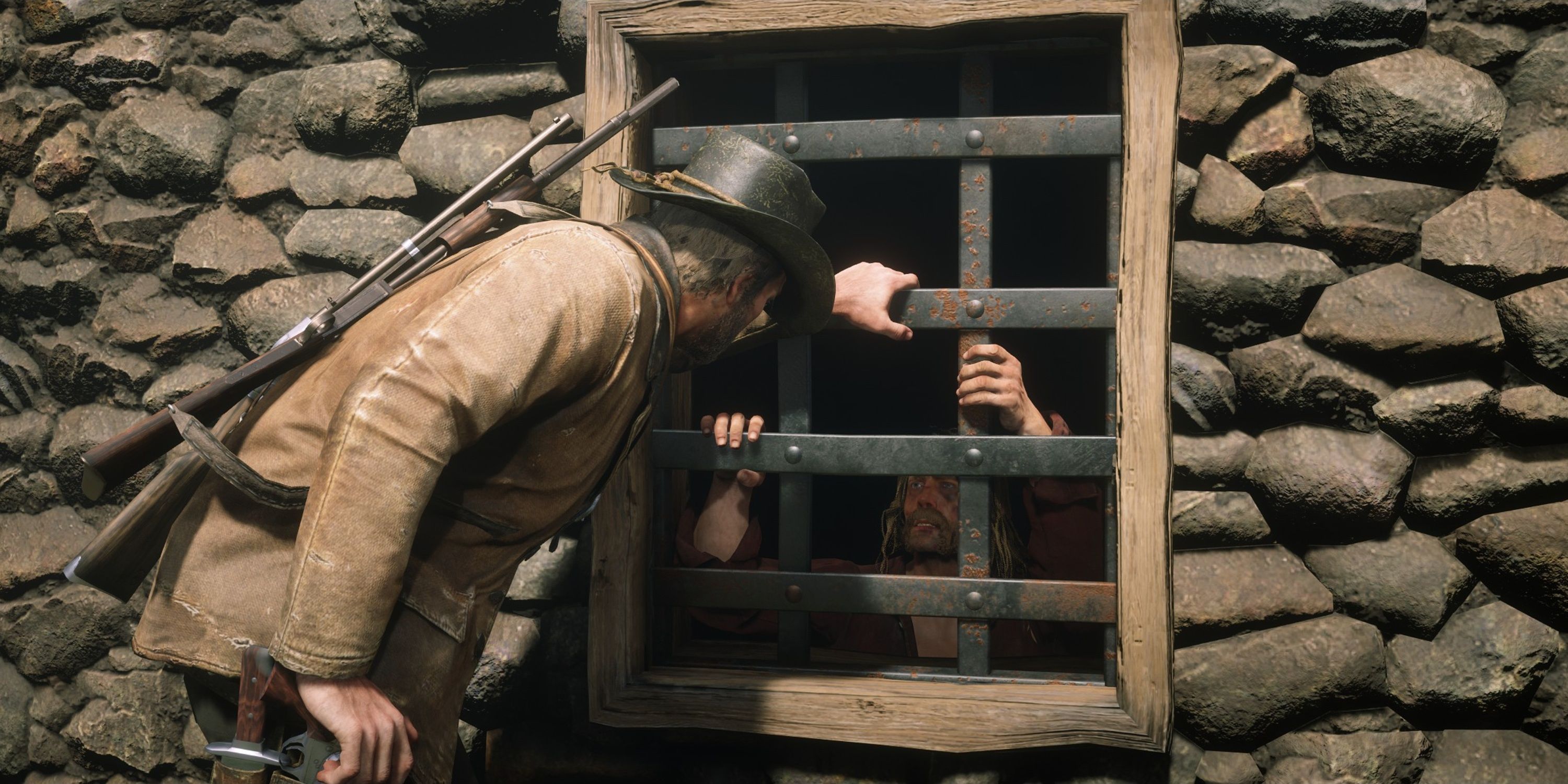 Arthur watches micah in his cell