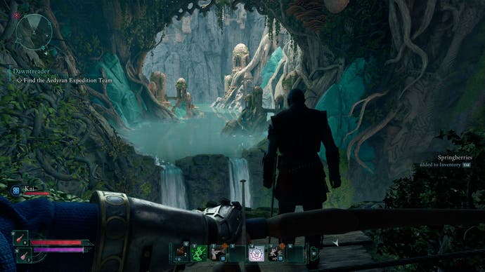 An Avowed screenshot. A first-person viewpoint of a turquoise and green-filled cave, that has a waterfall and stream running through it. It's fantasy 101, and it's very appealing.