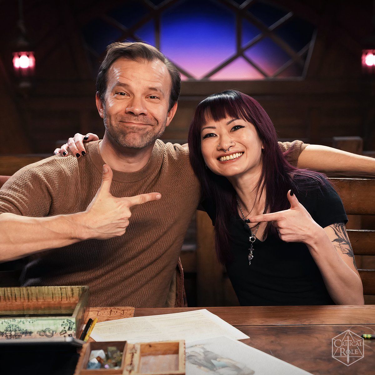 Liam O'Brien and Jasmine Don at the Critical Role table for EXU: Divergence. 