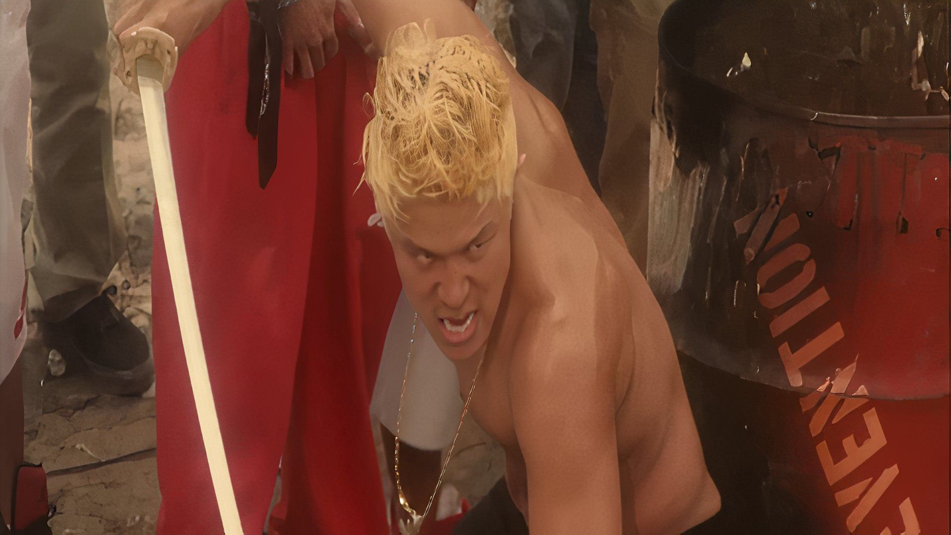 Mera attacking his opponent with a sword in Tokyo Tribe.