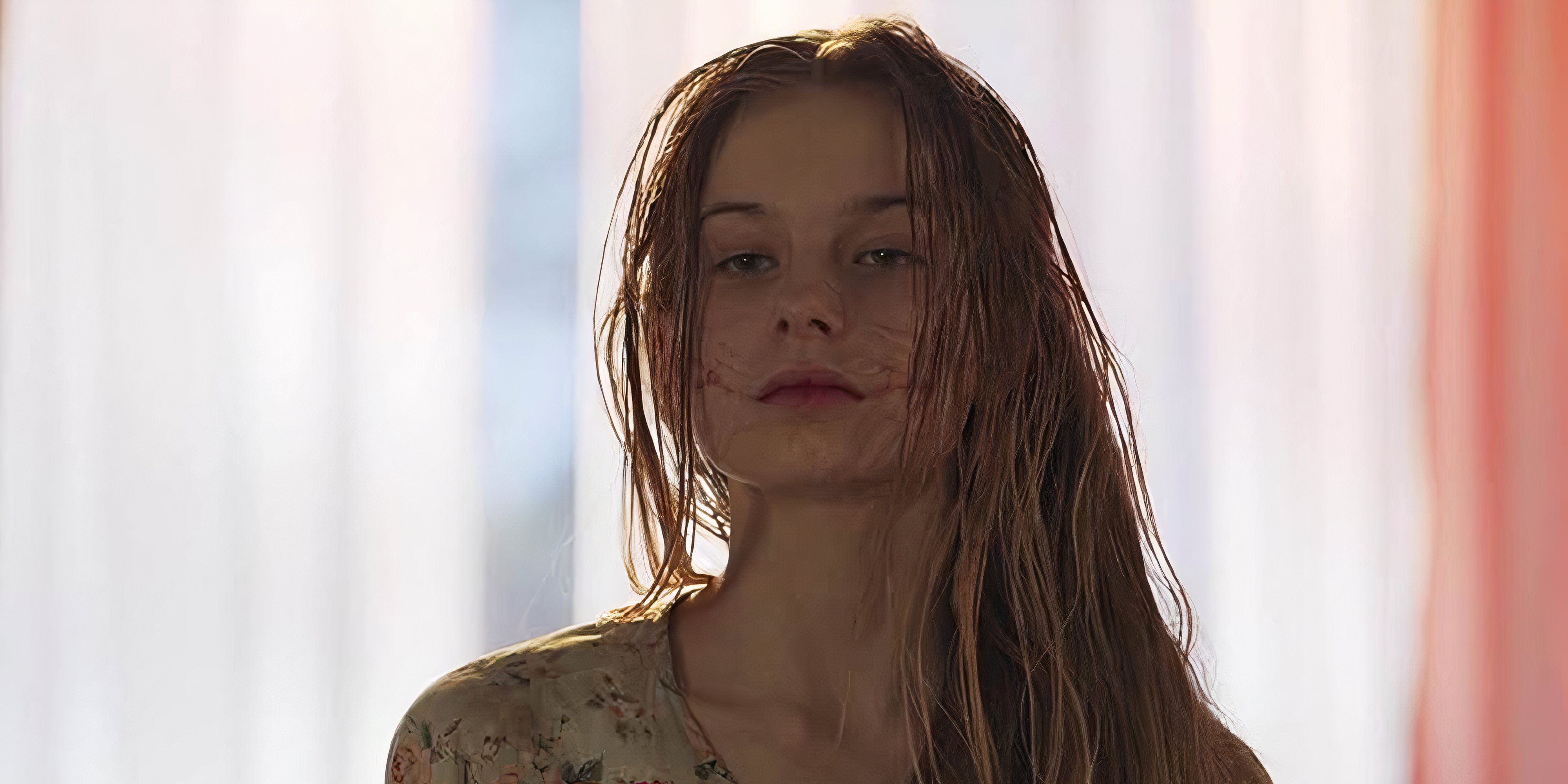 8 Best Body Horror Movies of the 2020s A blond girl with scars around her mouth