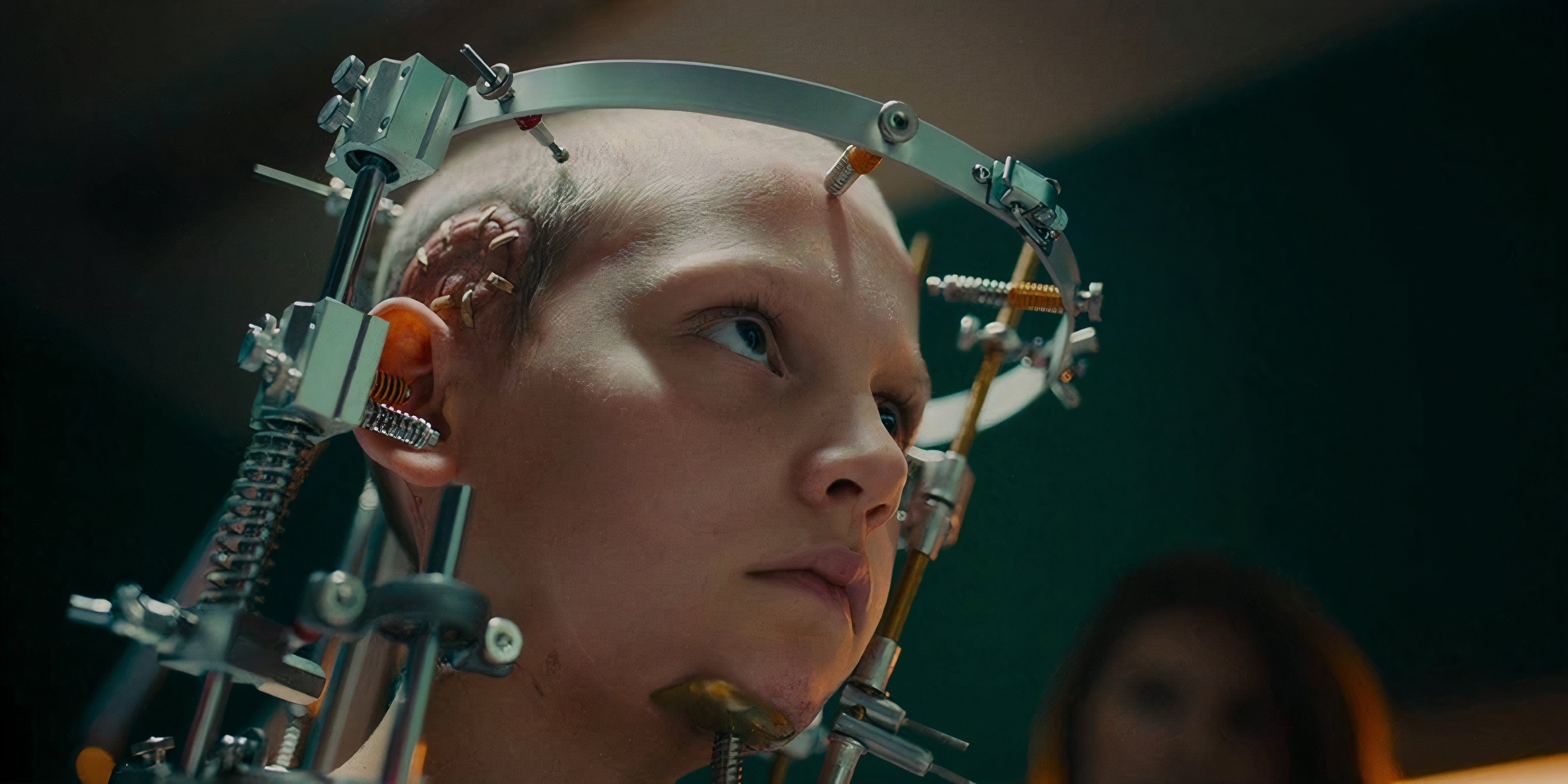 8 Best Body Horror Movies of the 2020s a young girl with metal around her head a an operarion scar