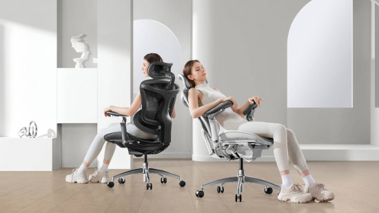 A woman wearing white sports gear reclines on a white chair, then on a black chair