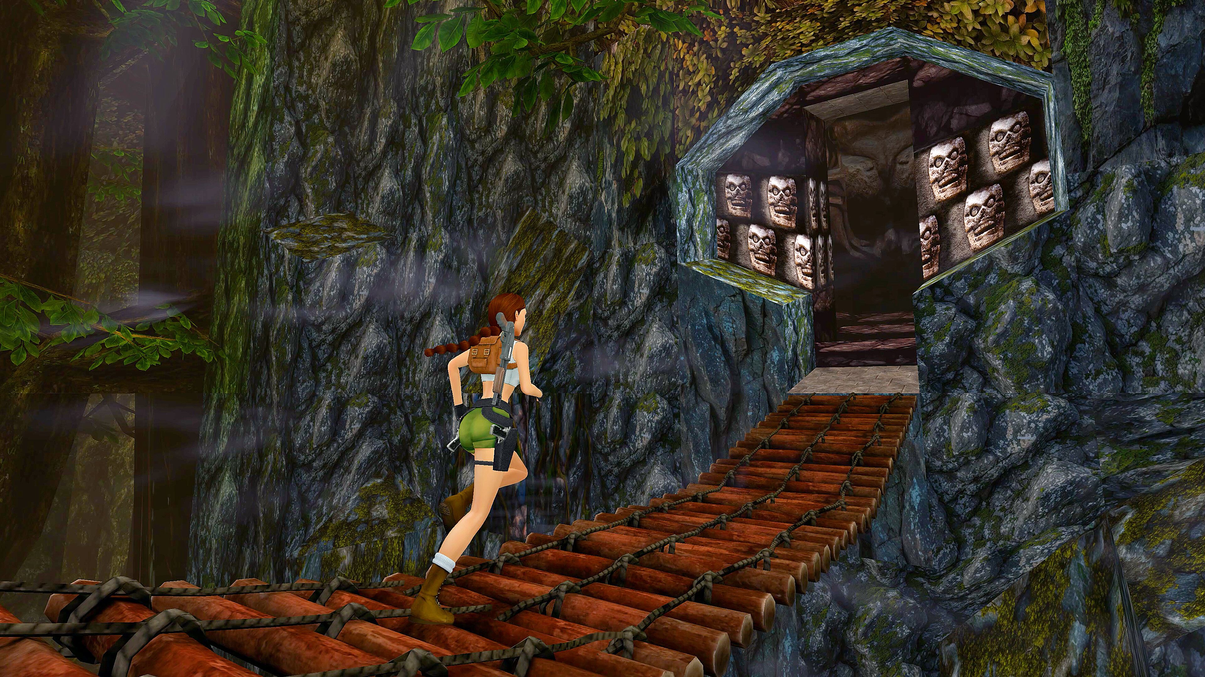 Tomb Raider Remastered - Lara running across a rickety bridge.