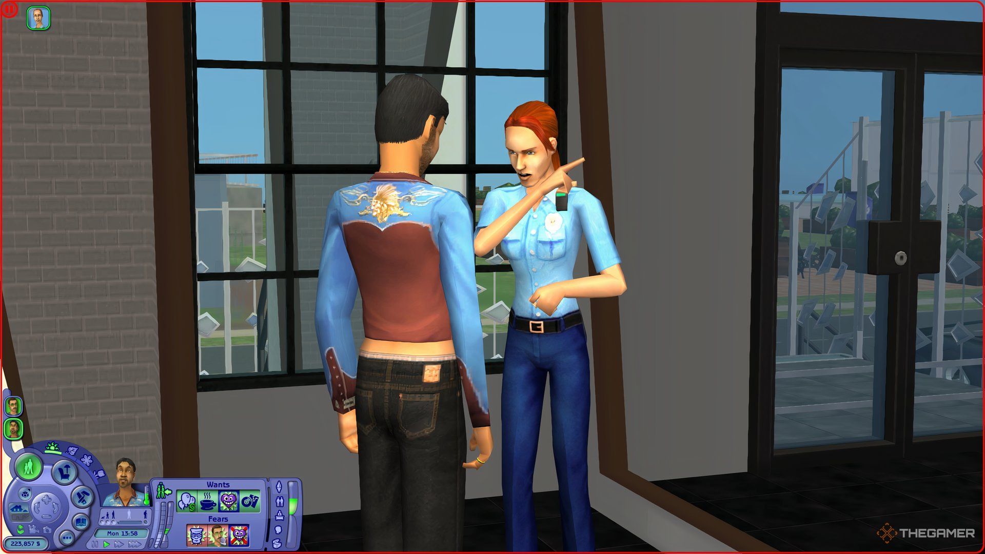 A Sim in The Sims 2 being scolded by the police for calling them to his house unnecessarily. 