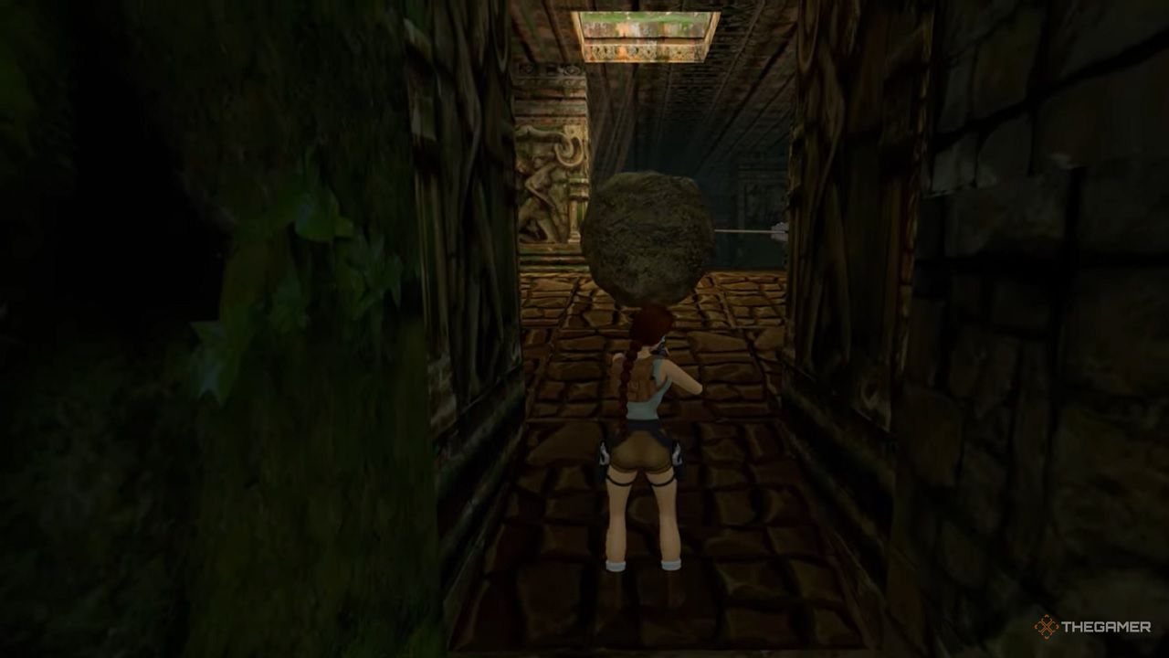 Lara Croft faces a big boulder in Tomb Raider 3.