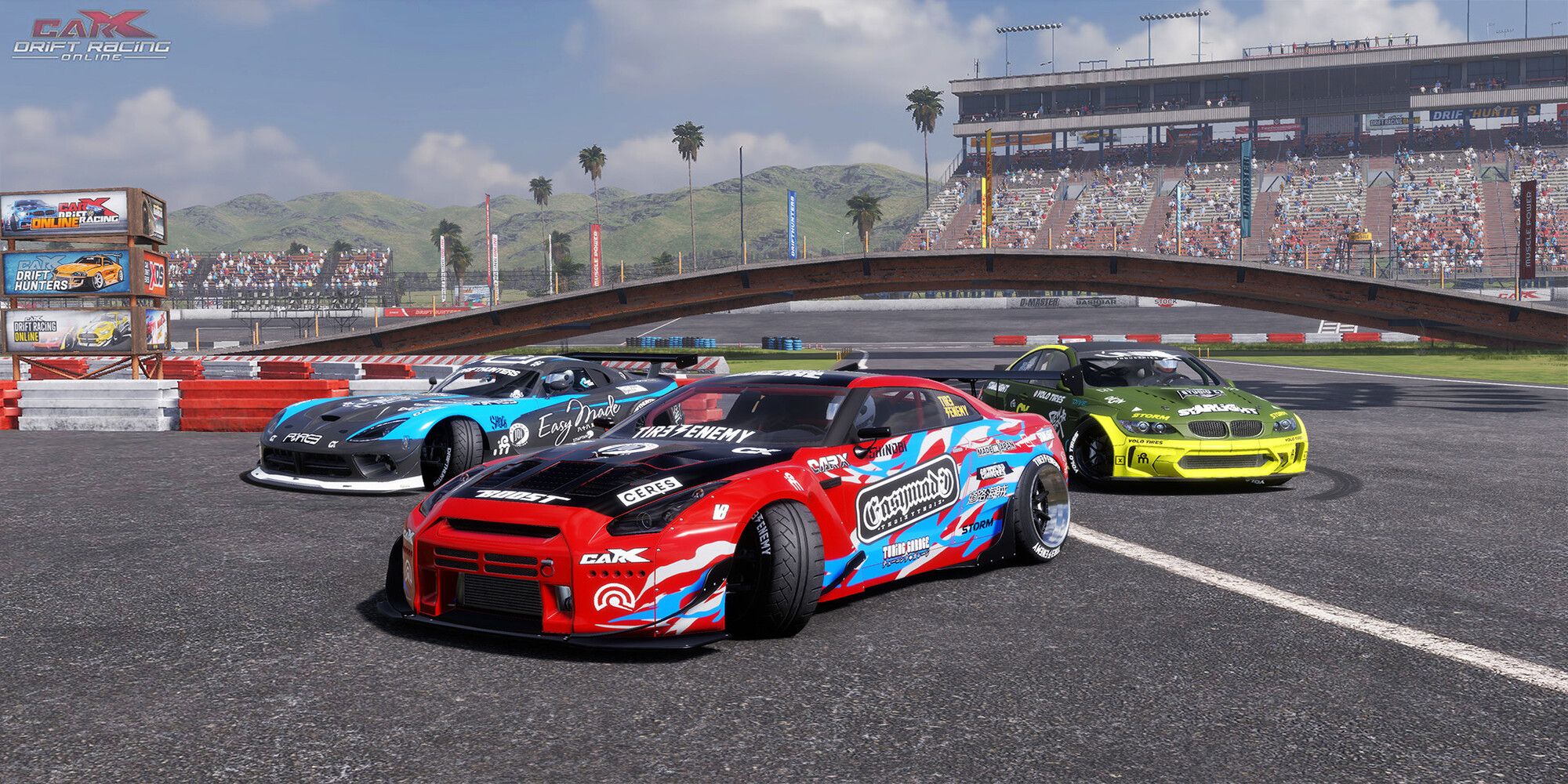 Three cars next to each other on a track.