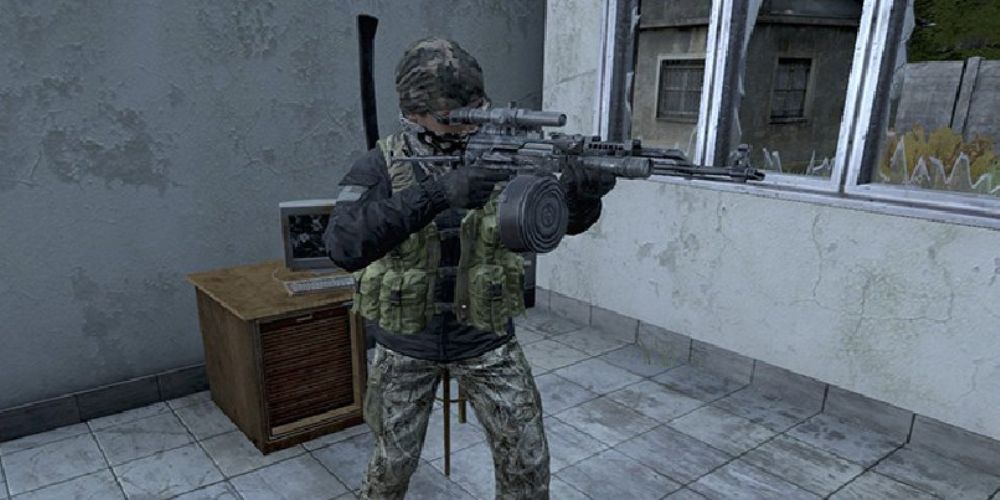 A DayZ character aiming a heavily modded assault rifle off screen.
