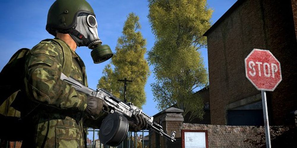 A Dayz screenshot of a person in a gas mask and military fatigues, holding an assault rifle.