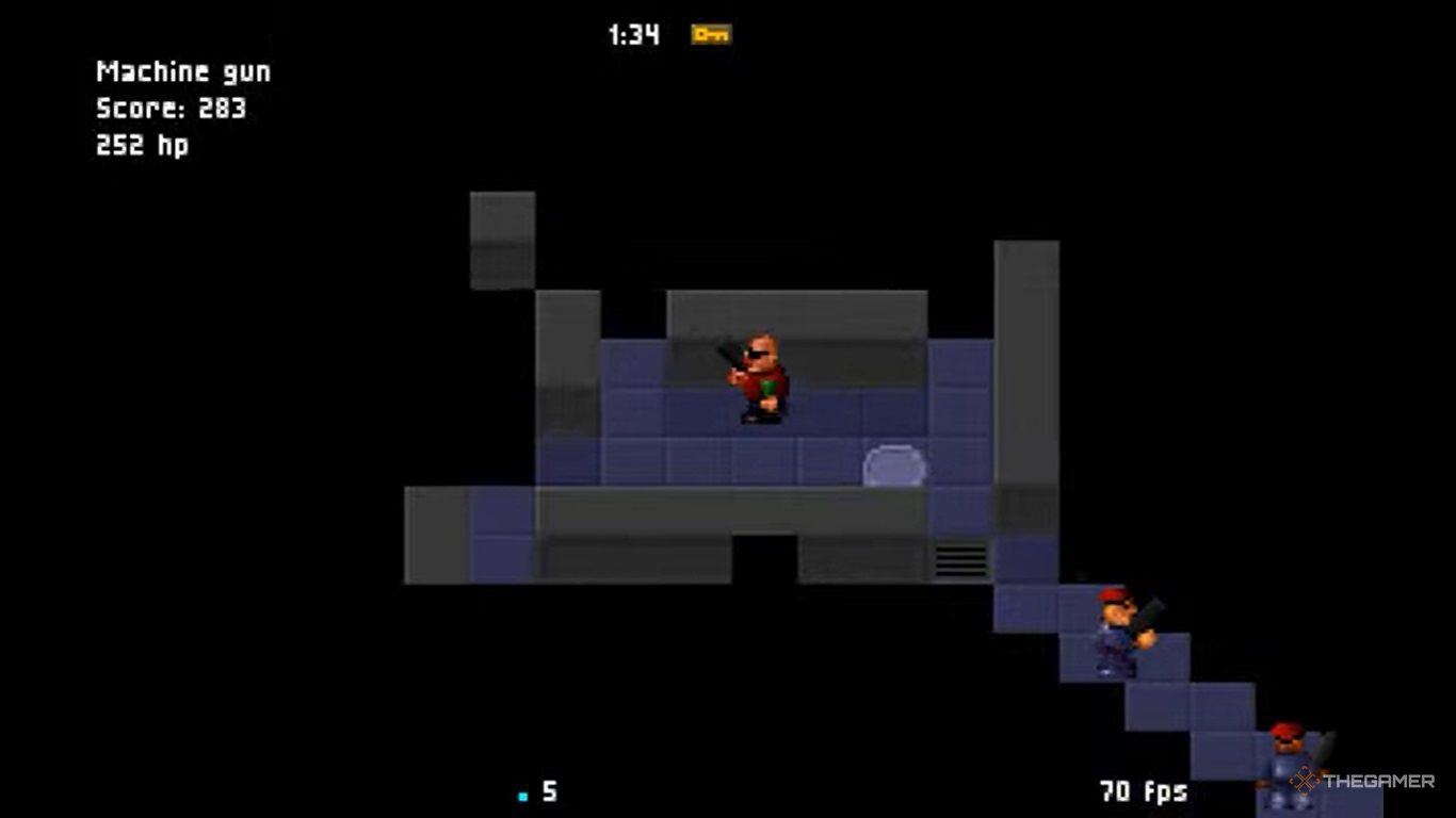 Gameplay of C-Dogs showing two characters with machine guns from a top-down perspective.
