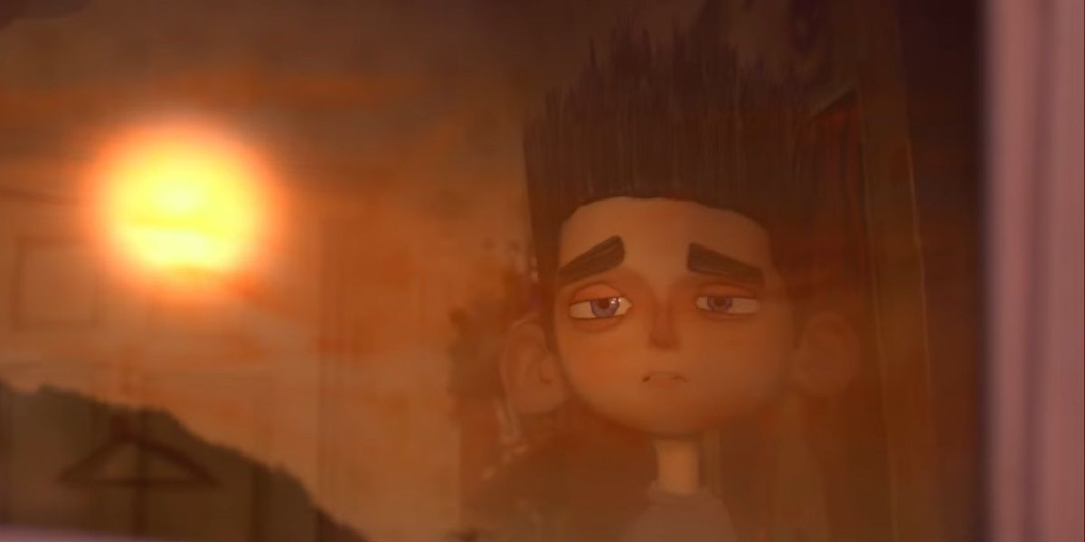 Norman looks at the rising sun from his window in ParaNorman.