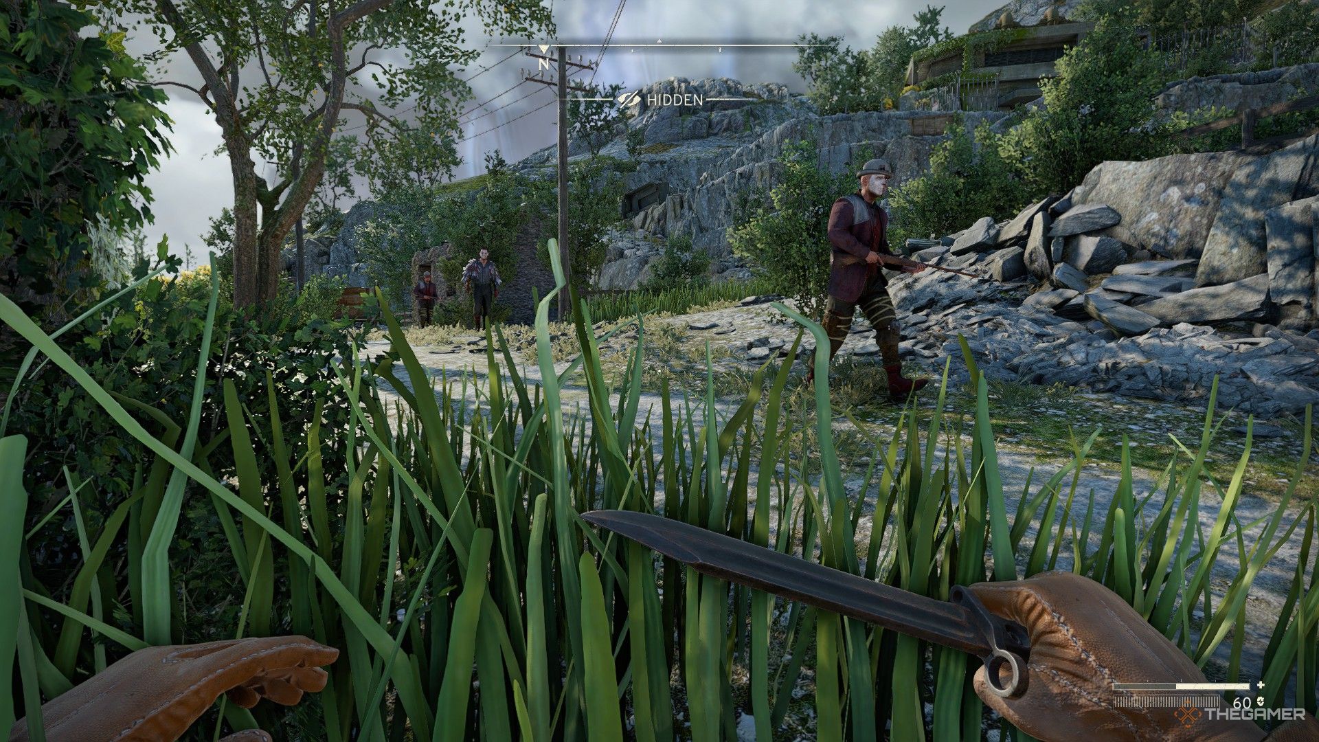 the player crouches in tall grass with their knife at the ready as an outlaw patrol passes in atomfall.