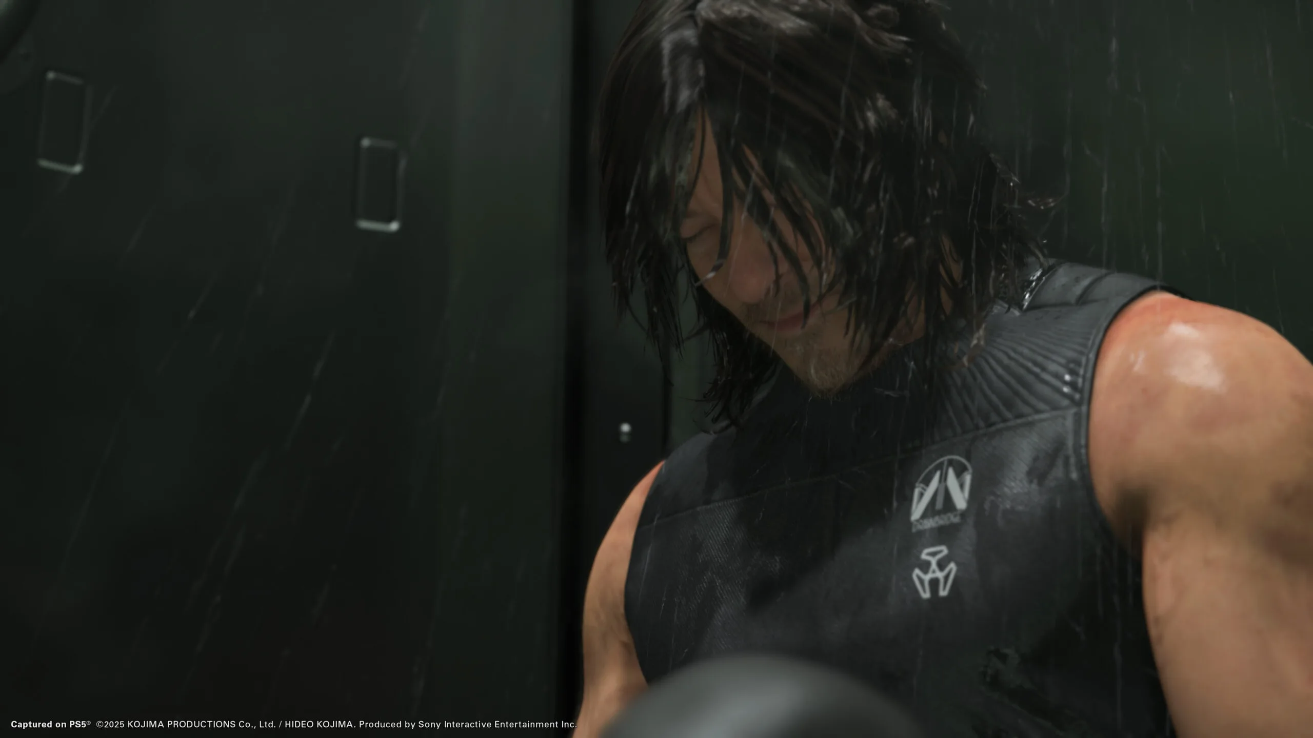 Norman Reedus crying in the shower with his clothes on in Death Stranding 2. 