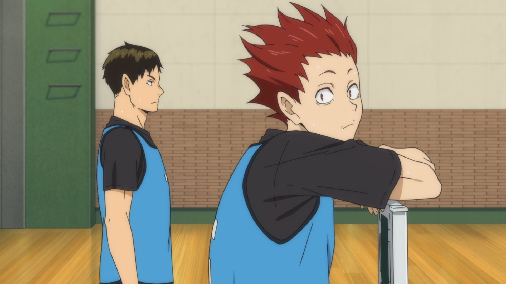 The image shows Satori Tendo standing next to Ushijima Wakatoshi in training outfit in Haikyu!!.