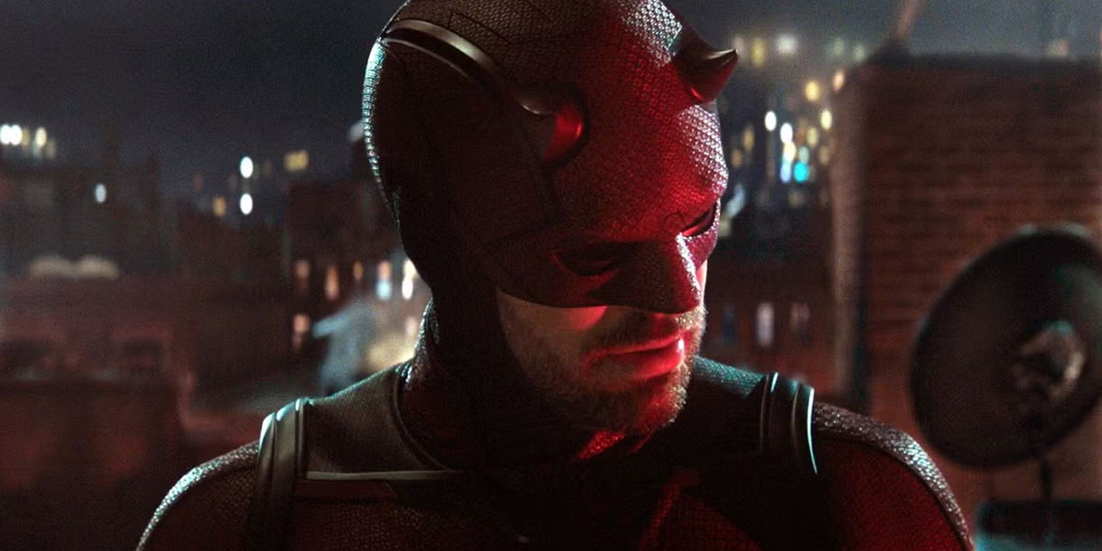 Daredevil on a rooftop looking over his shoulder.