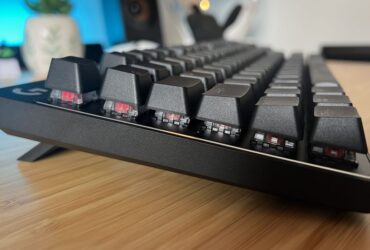 Side view of Logitech G Pro X TKL Rapid gaming keyboard on a wooden desk