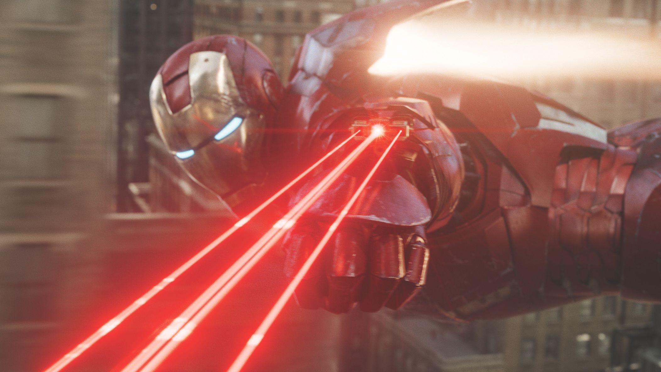 Iron Man firing three lasers while flying.