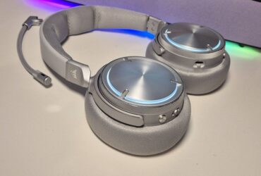 Photo of Corsair Virtuoso Max Wireless headset taken by writer Rosalie Newcombe, on a white desk.