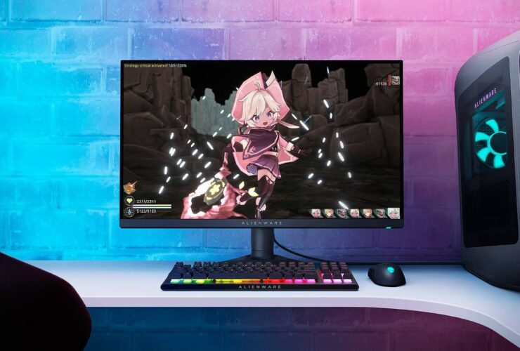 Alienware AW2724DM gaming monitor next to Aurora R16 PC on desk with RGB keyboard and mouse featuring Witch Spring R artwork on screen.