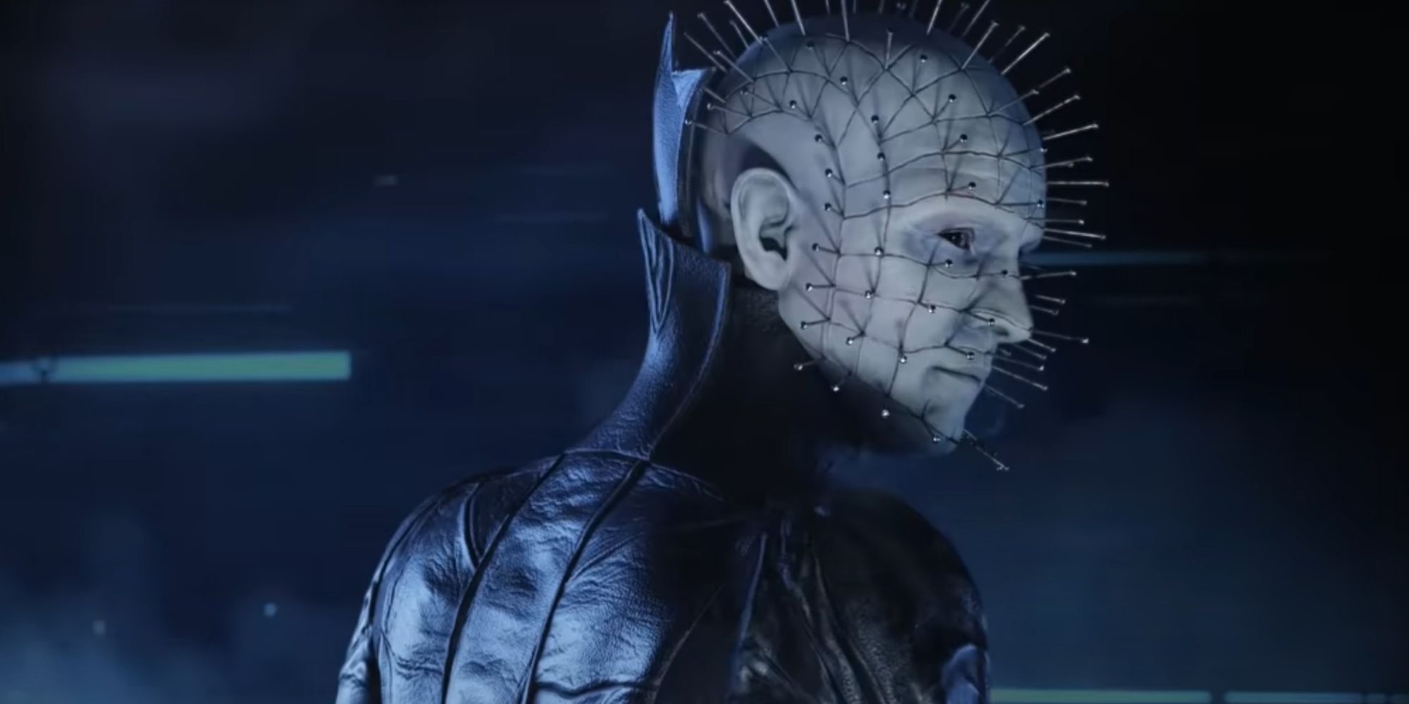 Pinhead looking over his shoulder towards the camera.