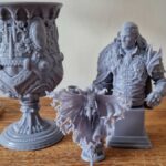 Models printed using the Anycubic Photon Mono M7 Pro, on a wooden table