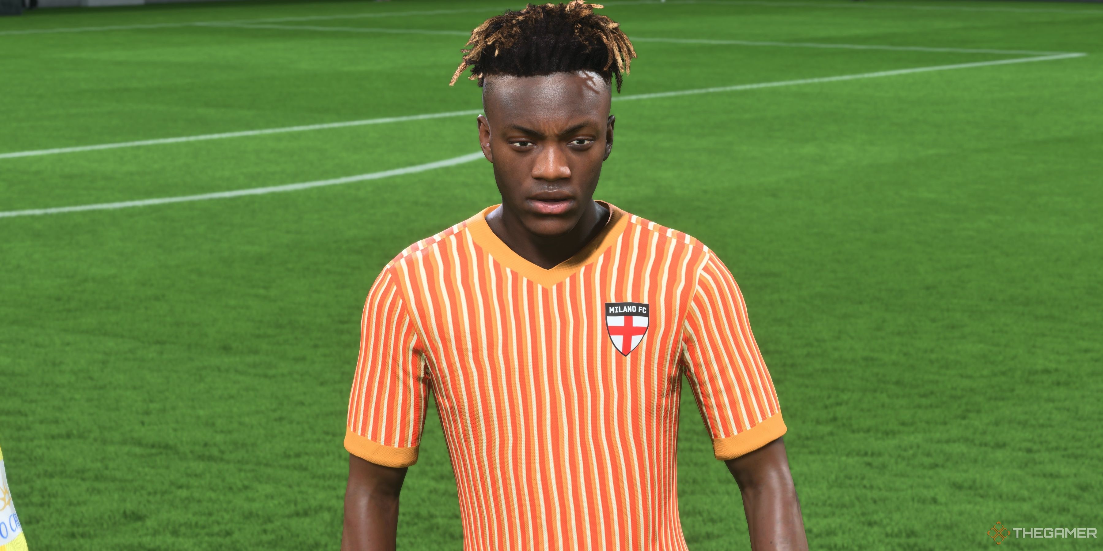 Tammy Abraham stands on the pitch in his Milano FC kit in EA Sports FC 25.