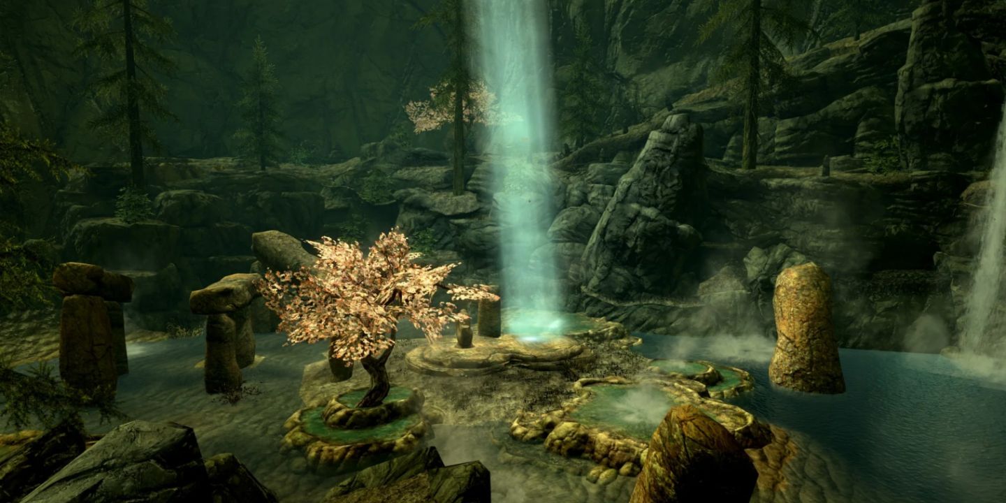 A shining light on a golden tree and rock formations in the Ancestor Glade in Skyrim.