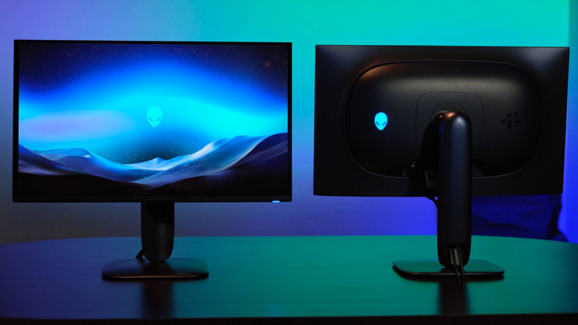 Back and front view of Alienware AW2725DM monitor with blue backdrop