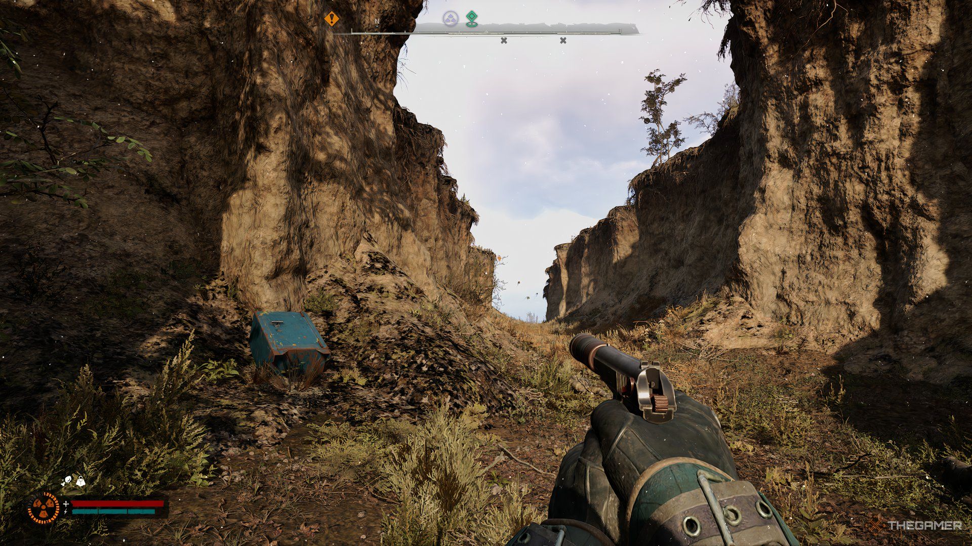 An image showing a blue safe on the left side of a cliff.