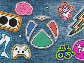 The Xbox logo as a patch sewn onto a denim jacket. The Xbox logo is surrounded by other patch versions of accessibility logos including the Xbox Adaptive Controller, the Game Accessibility Joyrider, the disability pride logo, and more.