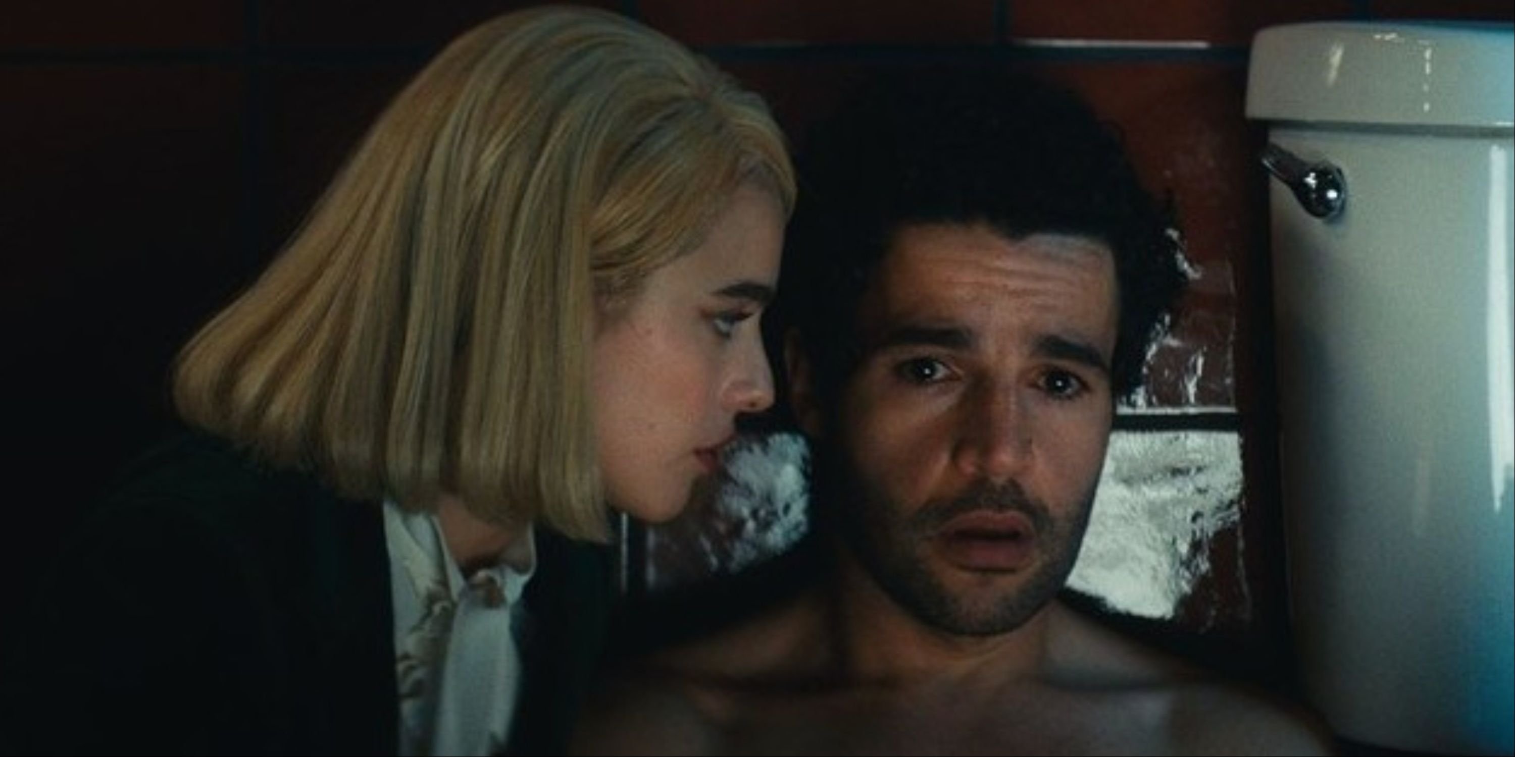 A close-up of Margaret Qualley and Christopher Abbott's characters by the toilet.