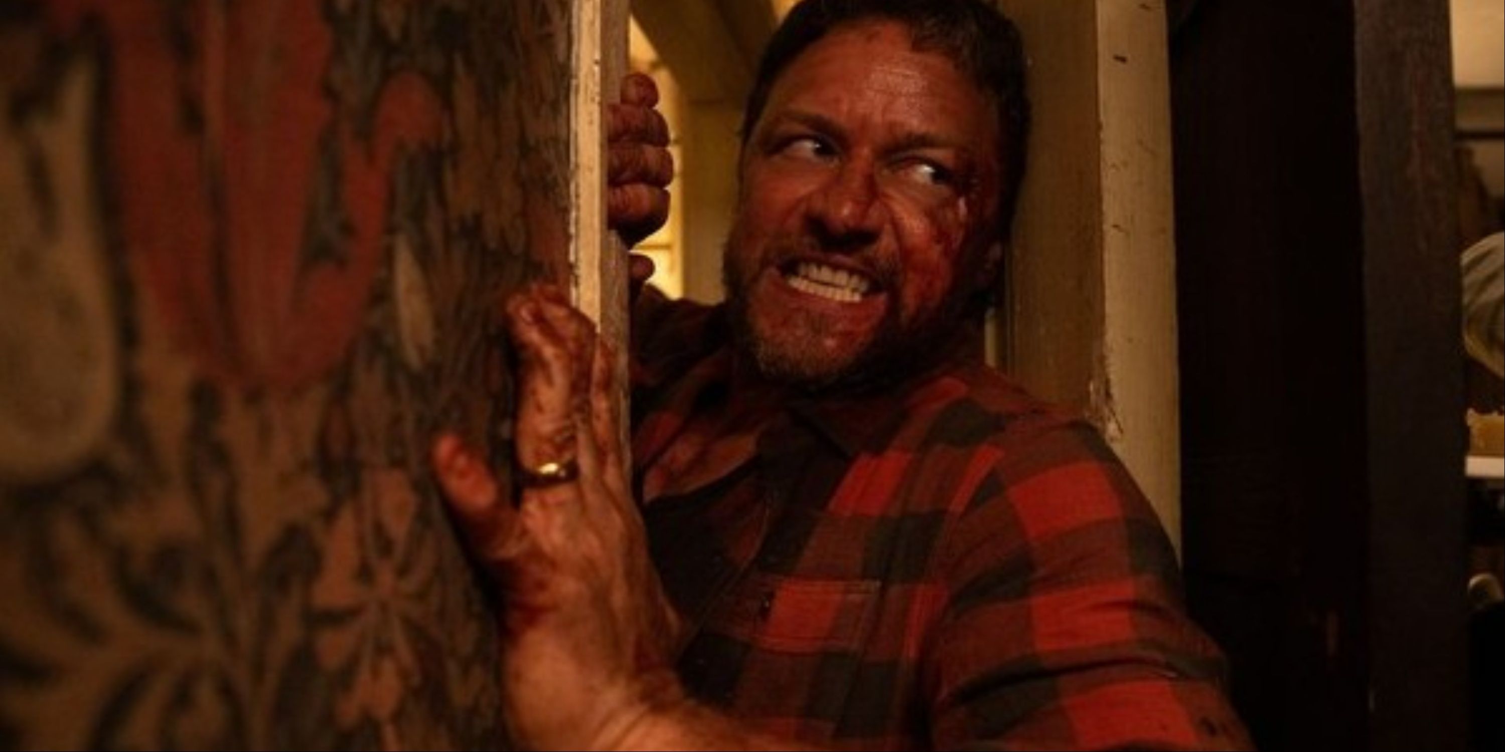 A vicious James McAvoy trying to break through a door and attack in Blumhouse's Speak No Evil.