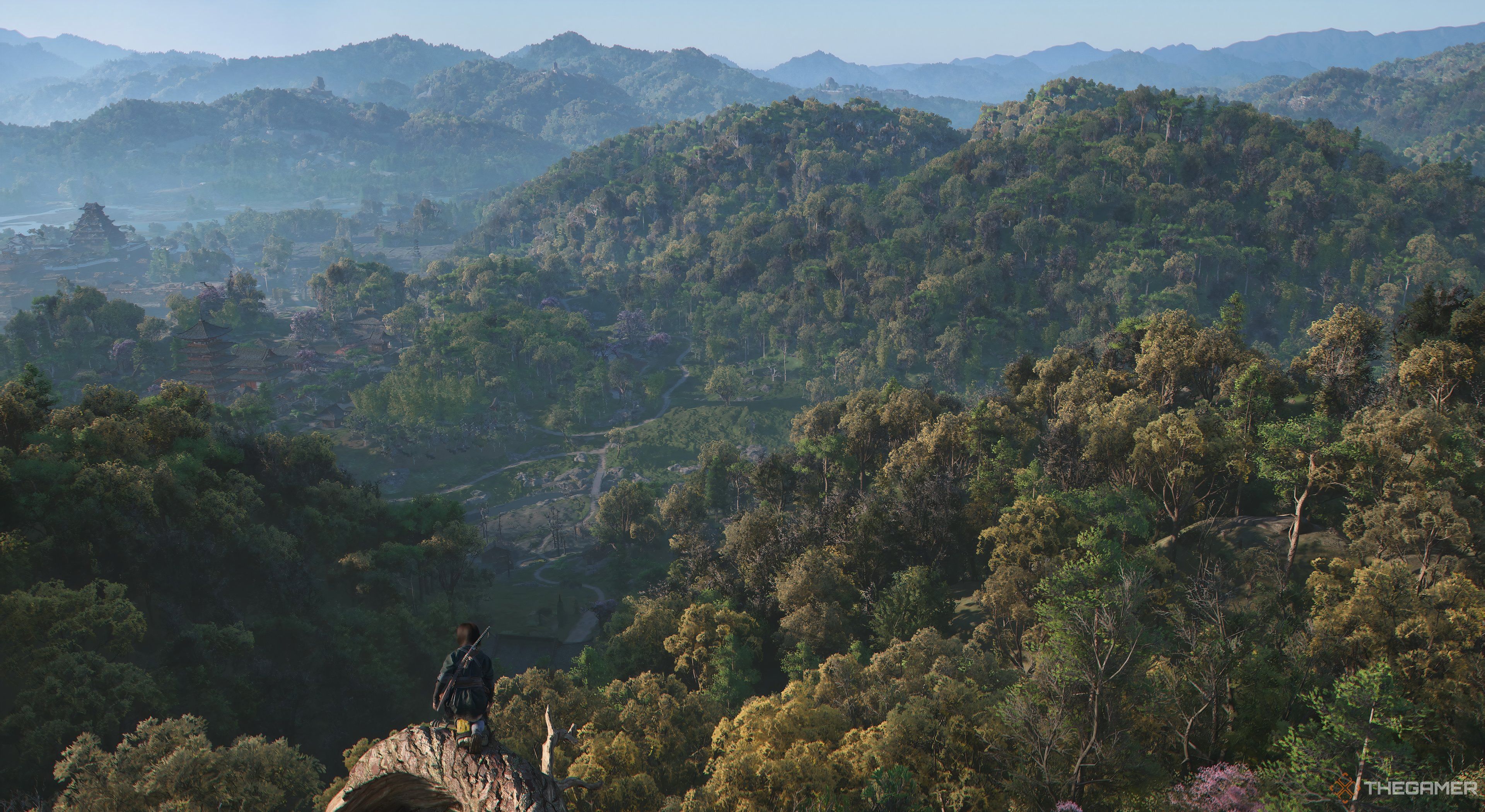Assassin's Creed Shadows Naoe on a Viewpoint with forested hills infront of her. 