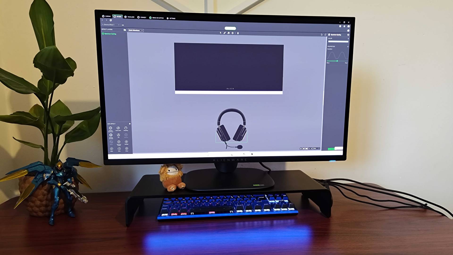 Razer Monitor Stand Chroma on desk with Alienware gaming monitor on top and Chroma app on screen.