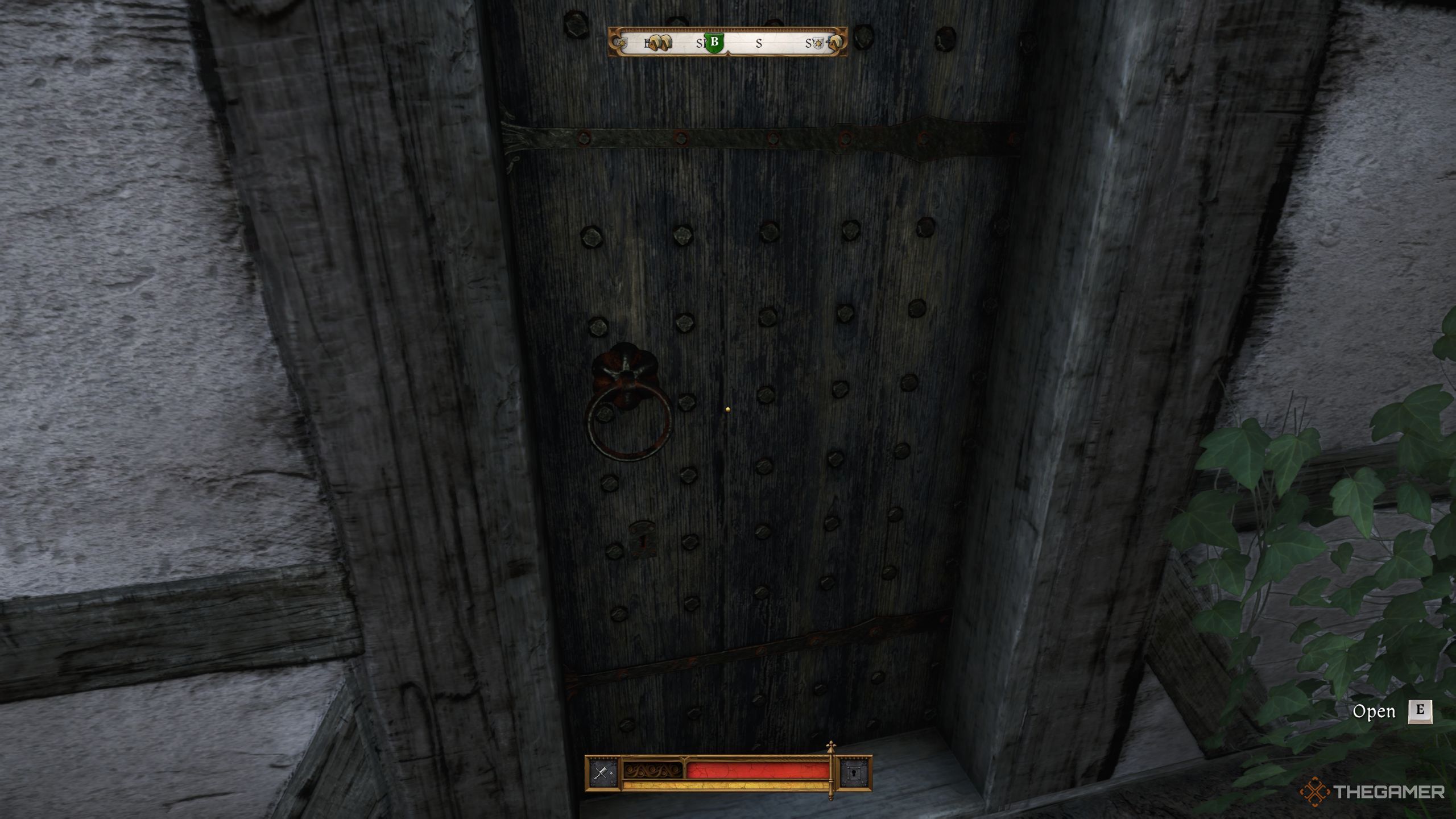 Henry standing in front of the hall's back gate in Kingdom Come: Deliverance 2.