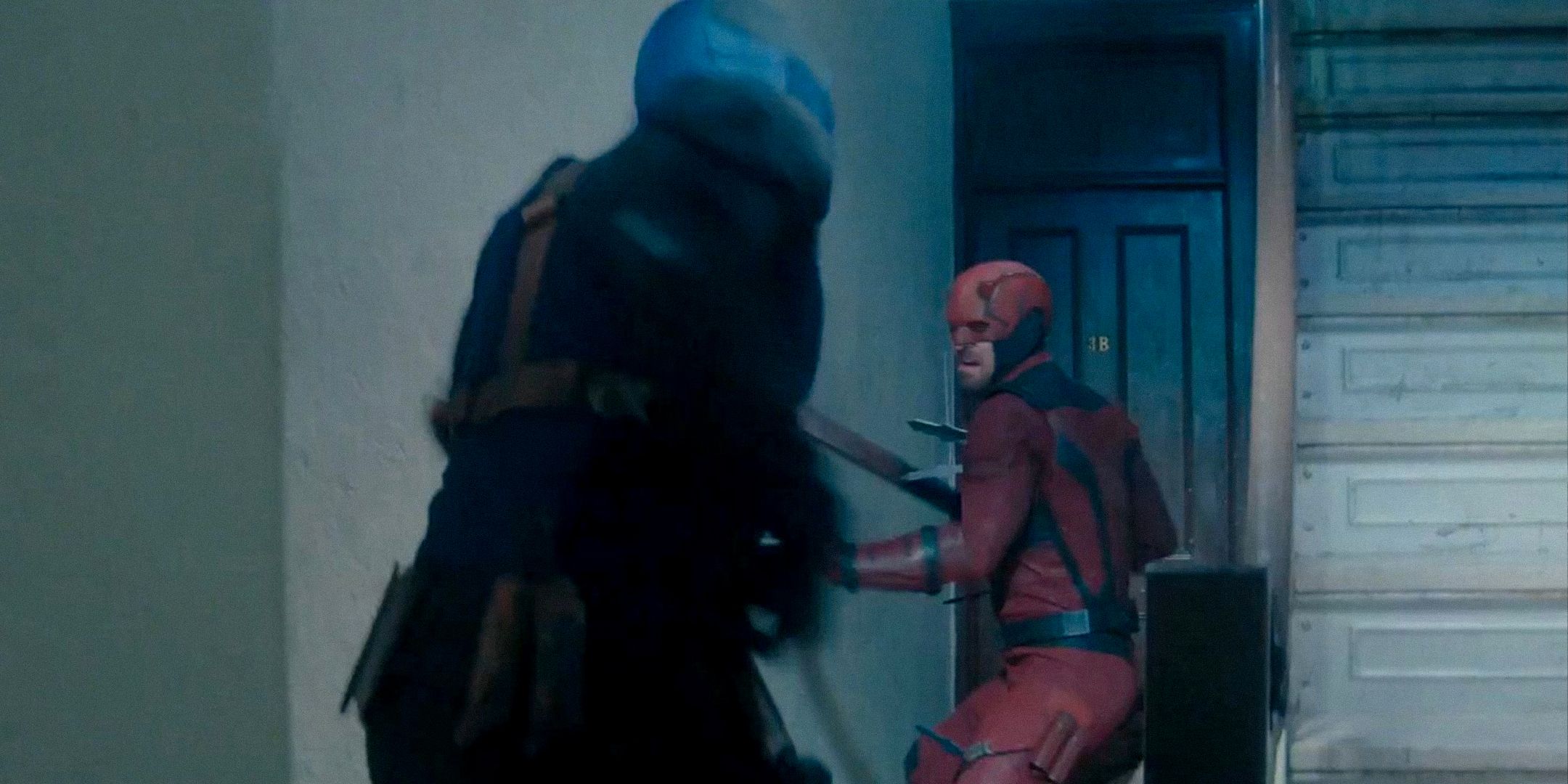 Bullseye and Daredevil fighting by a stairwell in an apartment.