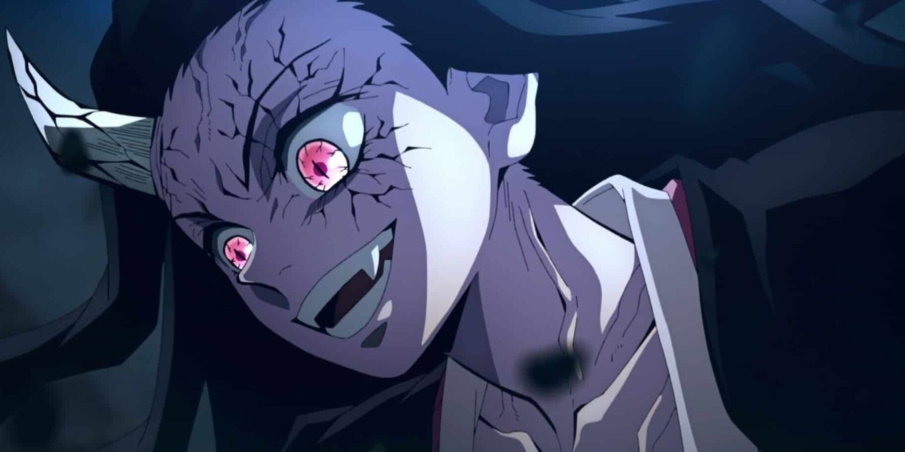 Demon Nezuko smiles joyfully as she attacks Daki in Demon Slayer.
