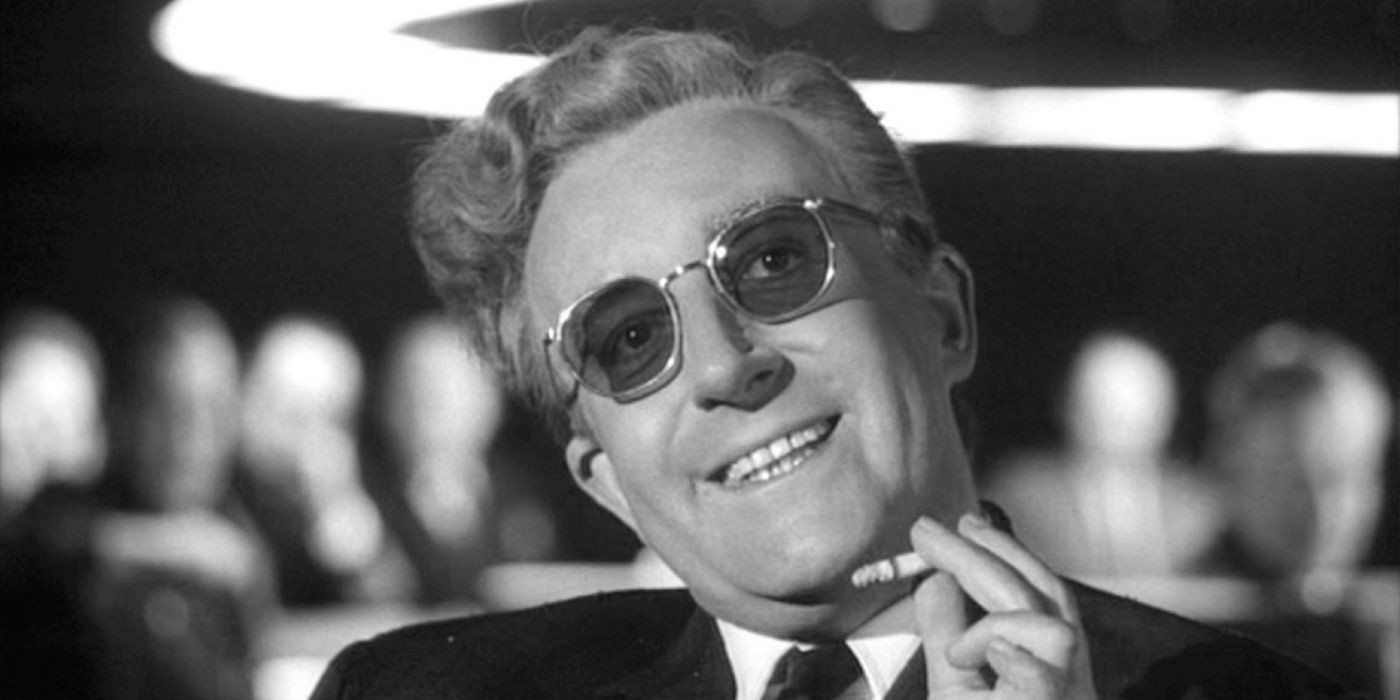 A close-up of Peter Sellers as Dr. Strangelove, holding a cigarette in hand.