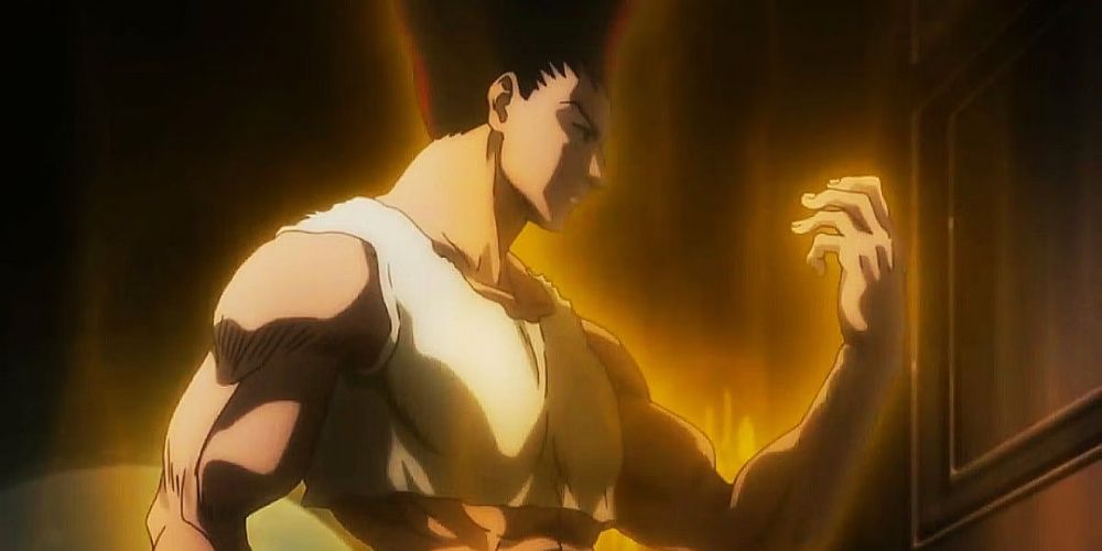 Gon Freecss from Hunter X Hunter in his adult form looking at his palm with a golden aura surrounding him.
