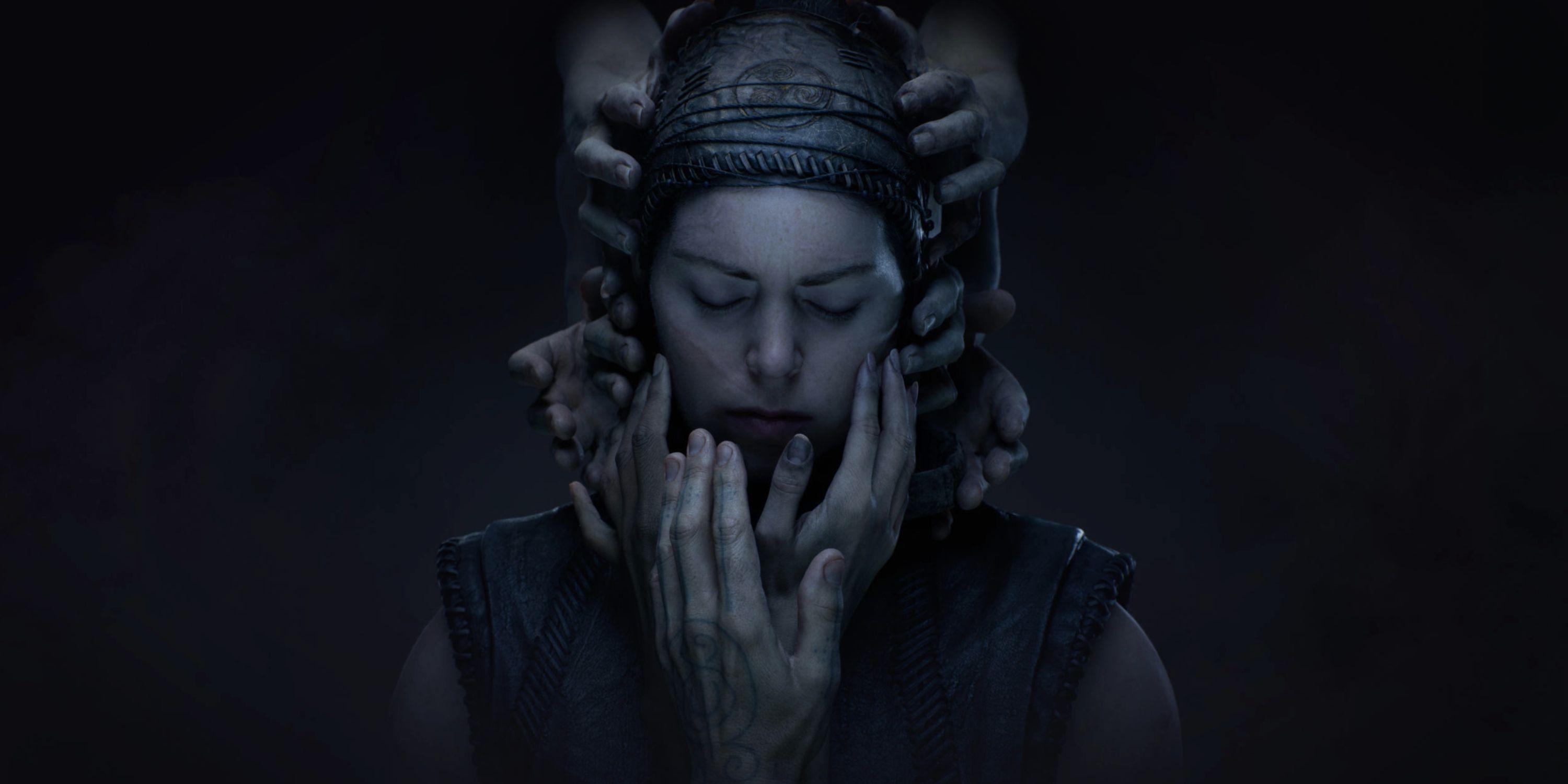 Hellblade 2 Cover art featuring Senua with hands all around her face.