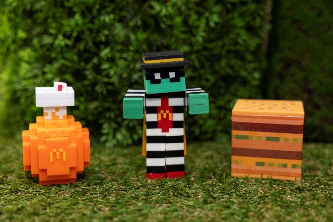 Three collectables from the A Minecraft Movie Meal at McDonald's